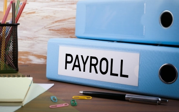Payroll Services for a Small Business with employee payroll records and business documents