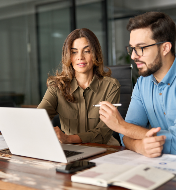 Two professionals reviewing Accounting-related data representing Tax and Accounting Services in Billings, Montana