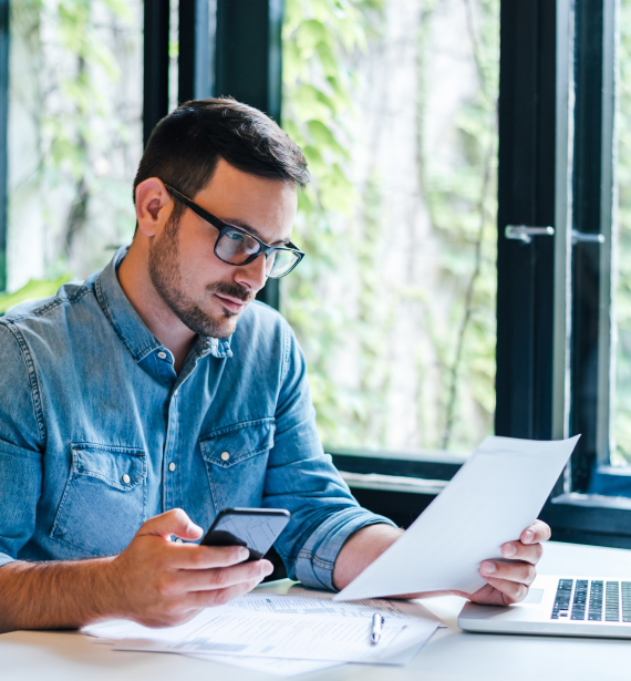 Accountant reviewing small business-related records, representing Tax, Accounting and Bookkeeping Services across USA