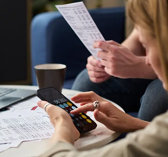 Two individuals checking personal finances with help of Individual tax preparation services in Billings, Montana